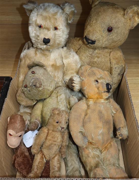 Five various sized plus teddy bears and a monkey hand puppet